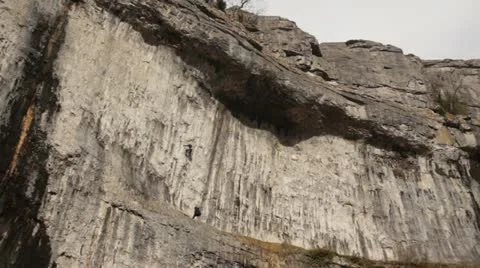 Rock climber on Cliff face Stock Footage 22283465