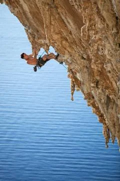 Rock climber on a cliff Stock Photos