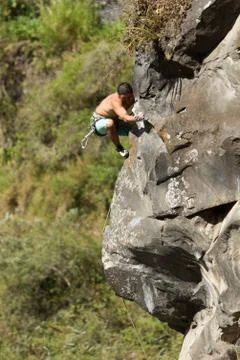 Rock Climber Climb Up A Cliff Stock Photos