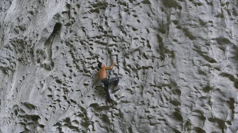 Rock climber climbs difficult route at Great Arch crag in China, Getu Stock Footage 71391166