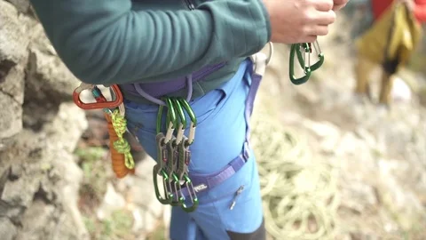 Rock-Climber Clipping Quickdraws To His Harness Stock Footage 82480869