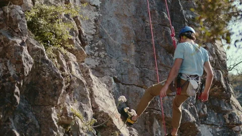 Rock Climber in Controlled Descent on a Limestone Cliff, Cinematic ProRes Shot Stock Footage 272627212