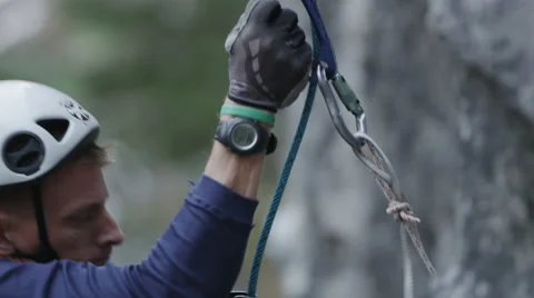 Rock Climber Face Abseiling Down Steep Rock Wall Stock Footage 64307365