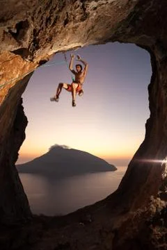 Rock climber falling a cliff while lead climbing Stock Photos