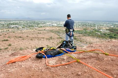 Rock climber getting ready to rappell Stock Photos