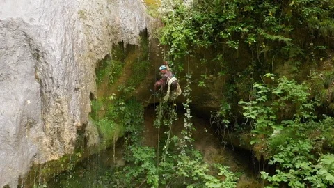 Rock Climber Going Down Ropes In A Deep Canyon Stock Footage 126751687