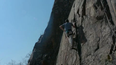 Rock climber on granite wall Stock Footage 48618319