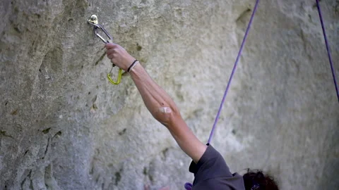 Rock climber hanging and testing climbing clipper Stock-Footage 131837779