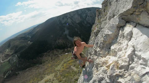 Rock climber high up on limestone cliff HD Stock-Footage 36580331