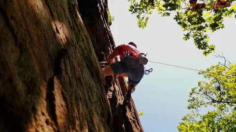 Rock Climber practicing on boulder wall 4k Video stock 114579867
