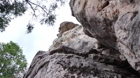 A rock climber pulling his rope down after a climb Stock Footage 249120556