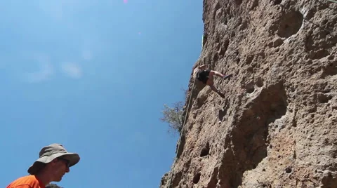 Rock Climber Rappelling Down a Sheer Cliff from Below at Malibu Creek State Park Stock Footage 41910455