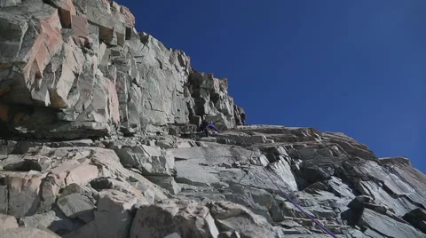 Rock Climber on rock face Stock Footage 55539440