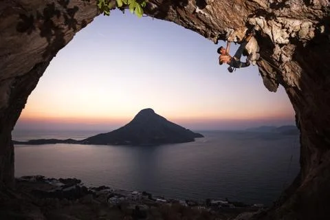 Rock climber at sunset. Foto stock