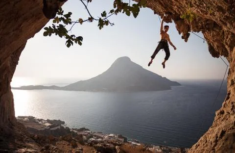 Rock climber at sunset. Foto stock