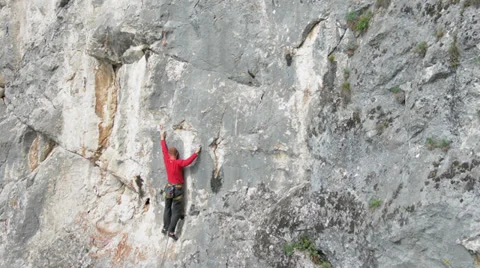 Rock climber tries dificult move and falls HD Stock Footage 37614028