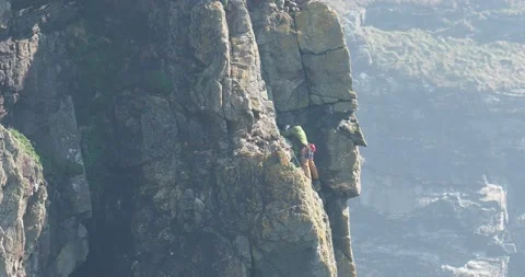 Rock climbers on South Stack, Anglesey, Wales, UK. Stock Footage 240092056
