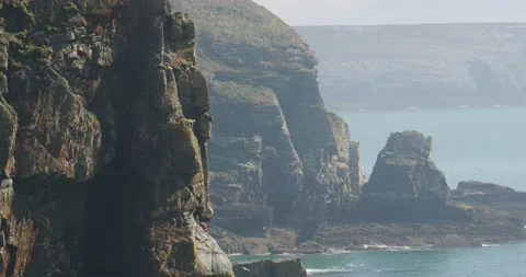 Rock climbers on South Stack, Anglesey, Wales, UK. Stock Footage 240093160