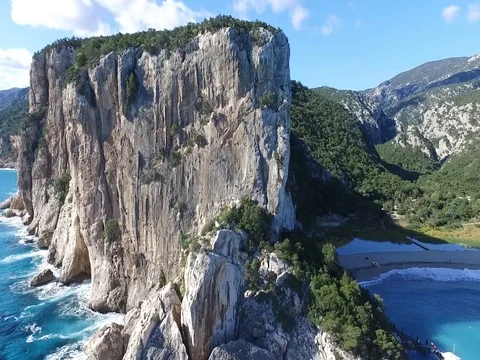 Rock climbing cliffs in Greece over the beautiful ocean Stock Footage