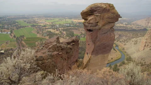 Rock climbing couple ascending Monkey Face, Smith Rock State Park, Oregon Stock Footage 227842102