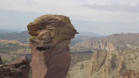 Rock climbing couple ascending Monkey Face, Smith Rock State Park, Oregon Stock Footage 227936398
