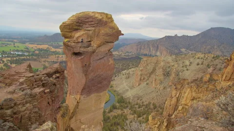 Rock climbing couple rappelling off Monkey Face, Smith Rock State Park, Oregon Stock Footage 228327390