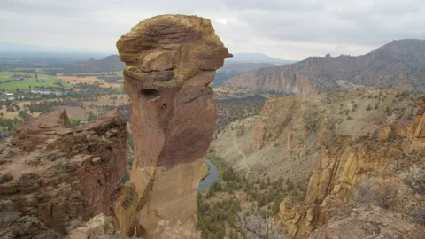 Rock climbing couple rappelling off Monkey Face, Smith Rock State Park, Oregon Stock Footage 228463276