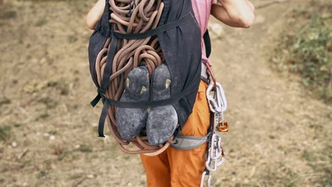 Rock climbing details. back view woman with backpack for climbing equipment Stock Footage 119376766