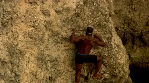 Rock Climbing out of Lagoon Stock Footage 22159316