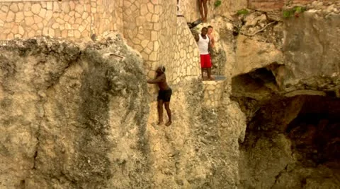 Rock Climbing out of Lagoon Stock Footage 22159319
