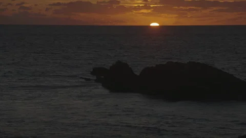 Rock close-up as sun sets at horizon Vídeo Stock 346282145