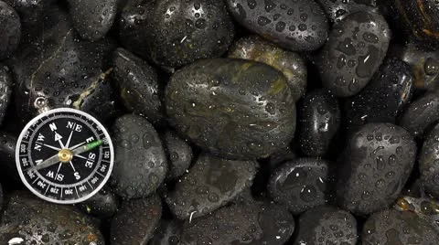 Rock with compass Stock Footage 8895590