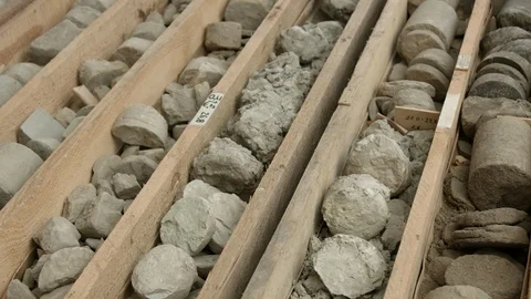 Rock core samples from drilled borehole in wooden box Video stock 123611005