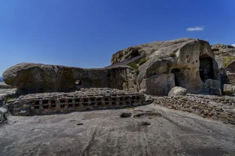 Rock cut structures and wine cellar in Uplistsikhe cave town Stock Photos
