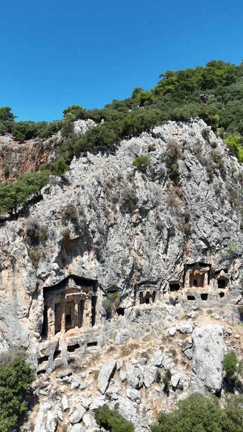 Rock-cut temple tombs in Ancient city of Kaunos, Dalyan valley, Turkey. Stock Footage 336402070