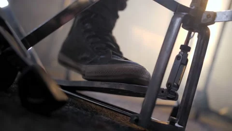 Rock drummer beating rhythm with foot on drum kit Video stock 114996170