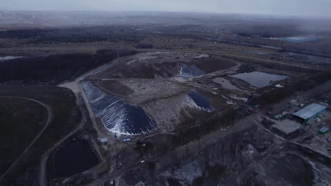 Rock dumps perform special function on huge quarry Stock Footage 256158338