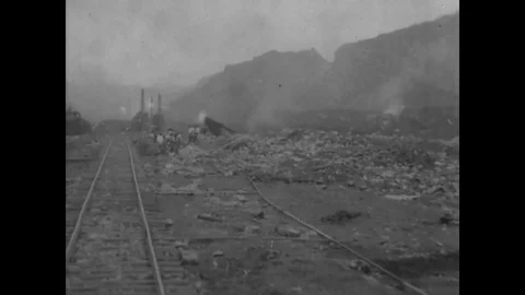 Rock is dynamited and removed by steam shovel and railroad crane - 1913-1914 動画素材 83661636