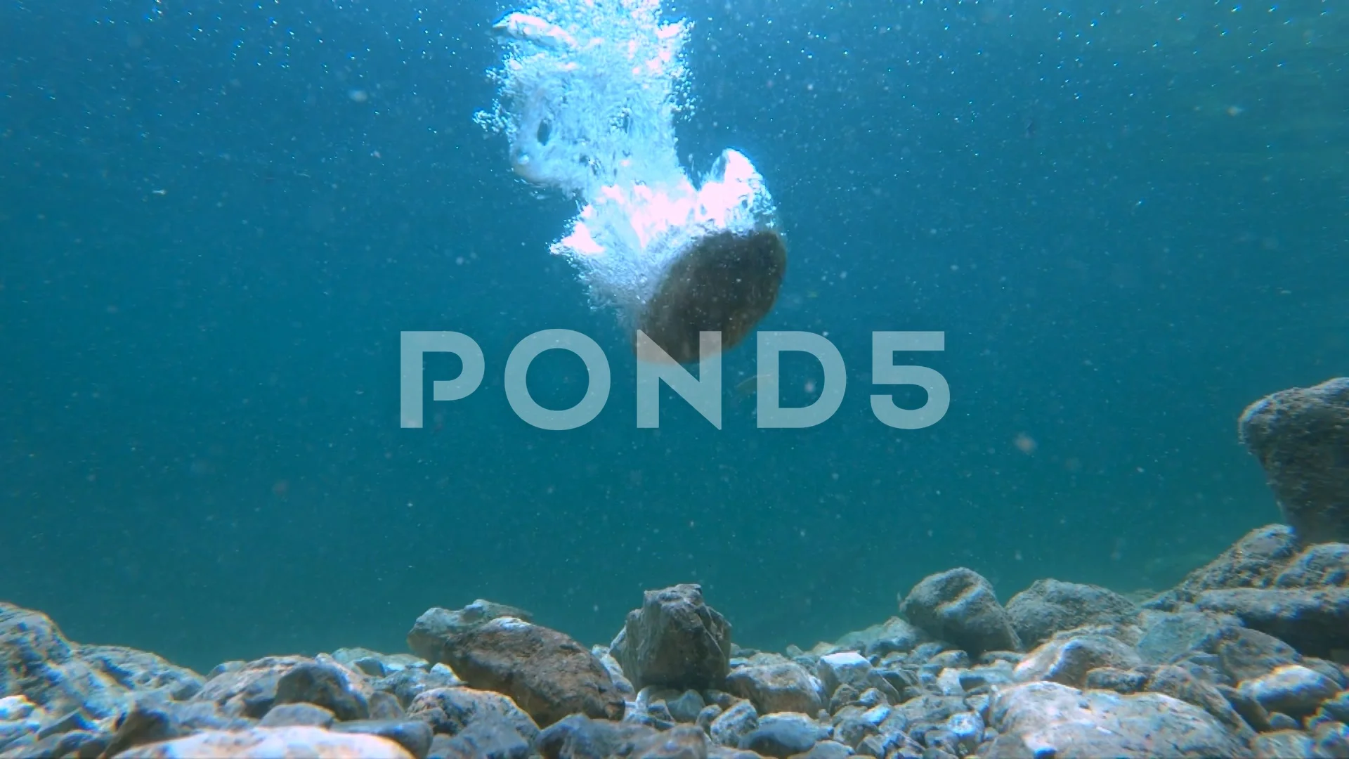 Rock falling in water. Underwater view of rocks floor in pristine lake, image size:1920x1080