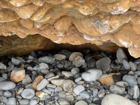 Rock filled cave Foto stock