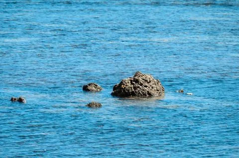 A rock is floating in the ocean Stock Photos