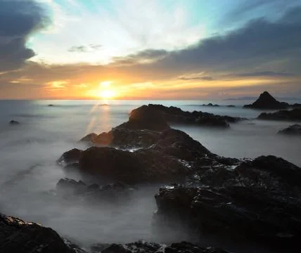 Rock flow at the beach Stock Photos