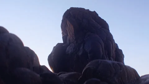 Rock Formation On Beach Under Blue Sky At Sunset Video stock 201324932