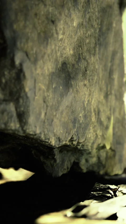 Rock formation captured from below in natural setting during daytime light Stock Footage 334259926
