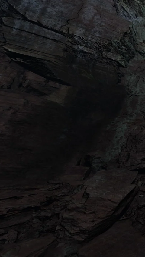 Rock formation in a cave with shadows and textured surfaces at dusk Stock Footage 335693978