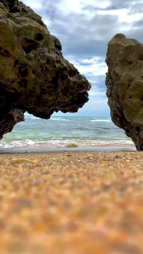 Rock Formation Framing Ocean View at Ngobaran Beach Yogyakarta Indonesia Stock Footage 336685544