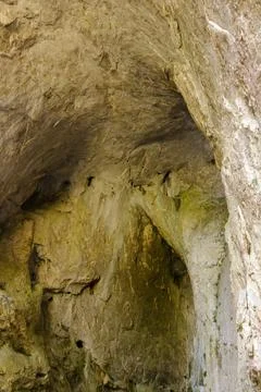 Rock formation inside a cave showcasing natural textures and colors in a re.. Stock Photos