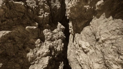 A rock formation with a narrow opening in the middle 스톡 동영상 265237696