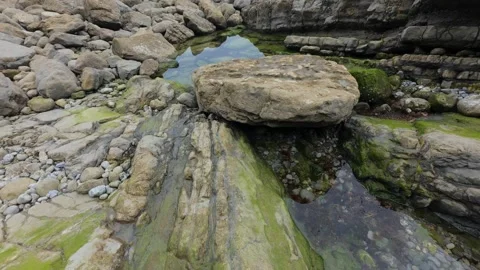 Rock Formation With Natural Tide Pool On Rocky Coast Stock Footage 340151697