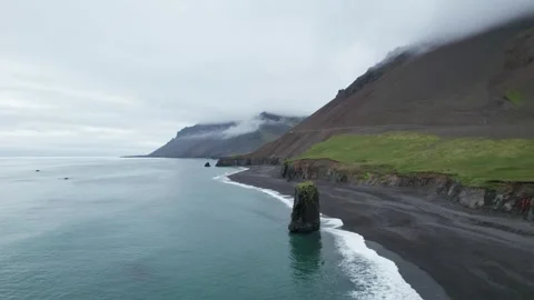 Rock Formation in Ocean Coast Next to Ring Road Iceland. Waves Crashing Stock Footage 258494555